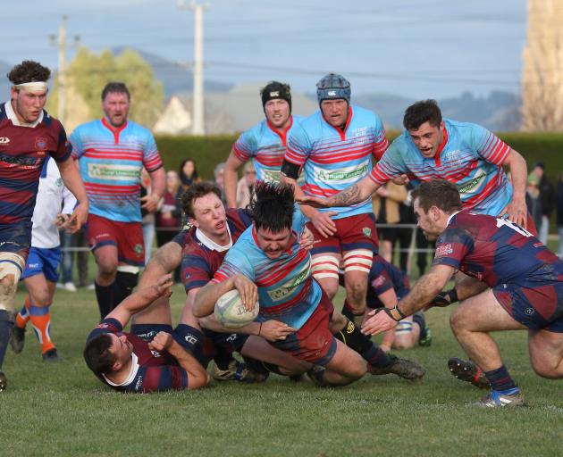 Clutha Valley forward Conrad Williams scores during the Southern region premier final in Outram...