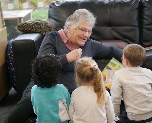 Helen Cottle reads to children at Richard Hudson
Kindergarten. Photo: Jessica Wilson