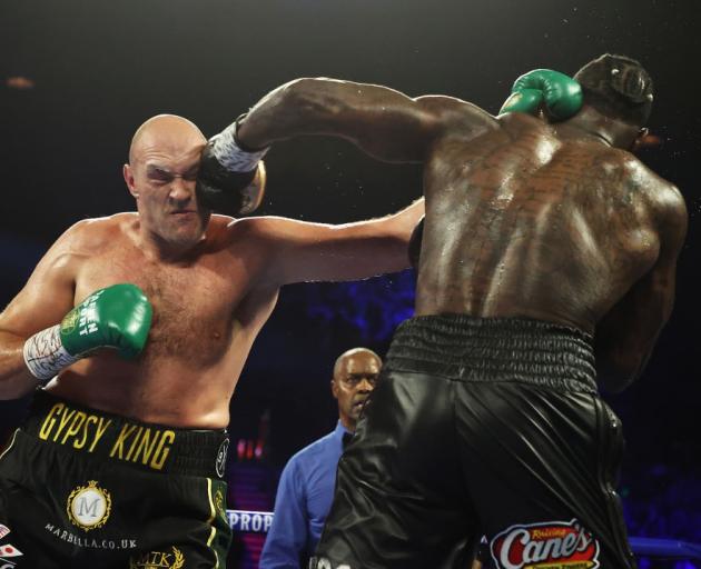 Tyson Fury (left) and Deontay Wilder during their second fight. Photo: Getty Images