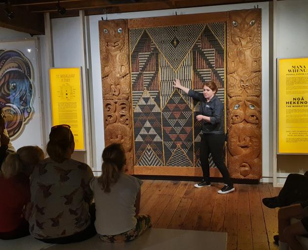 Wellington Museum visitor host Kate Gallaher explains the story of Ngake and Whataitai.