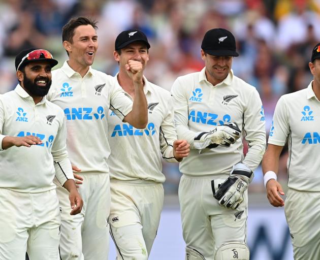 New Zealand paceman Trent Boult (second left) celebrates with team-mates (from left) Ajaz Patel,...