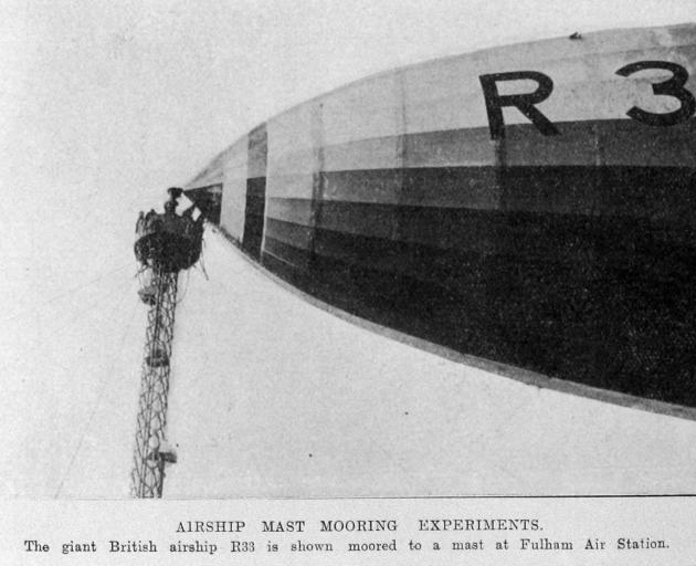 The giant British airship R33 is shown moored to a mast at Fulham Air Station. — Otago Witness,...