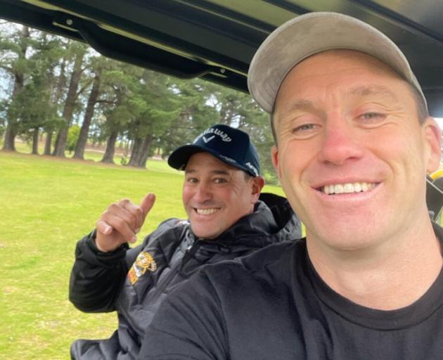 Former All Black Ben Smith (right) and Green Island coach Dean Moeahu share a laugh during a...