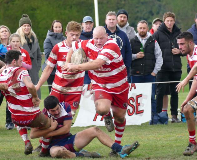 Clutha tight head prop Phil Keighley breaks through the West Taieri defence to make some yards...