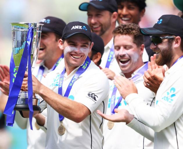 Tom Latham holds the trophy as the Black Caps celebrate their series win over England. Photo:...