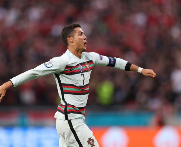 Cristiano Ronaldo celebrates a goal for Portugal during its win this morning at Euro 2020. Photo;...