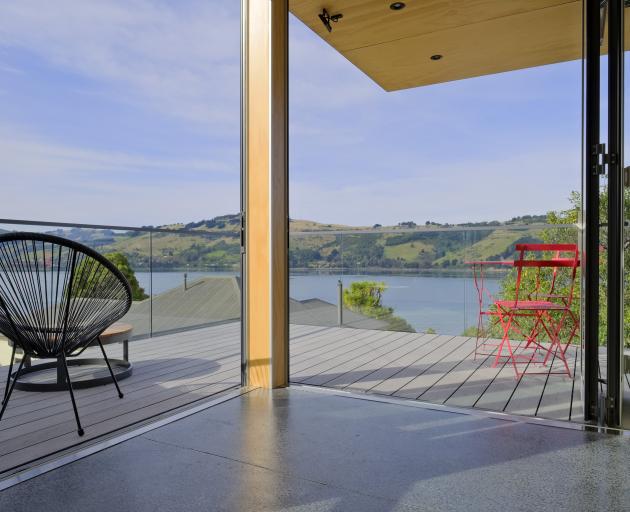 Doors off the dining area fold back to reveal Otago harbour and peninsula. There is a choice of...