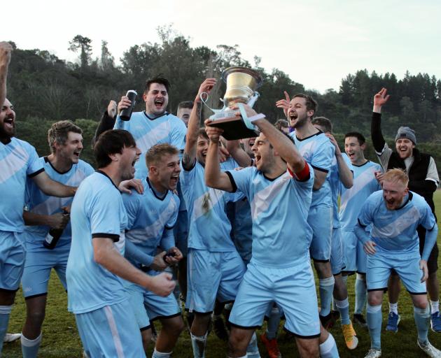 South City Royals captain Jared Grove holds the ODT Southern Premiership Trophy as he and team...