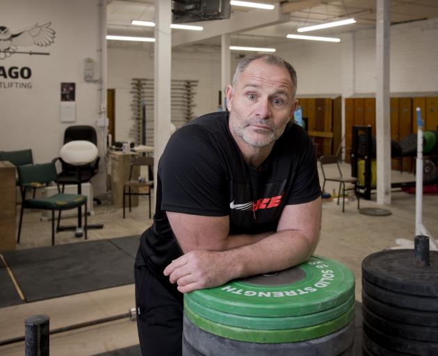 Graeme Evans back at work in the Otago Weightlifting gym after winning three medals at the World...