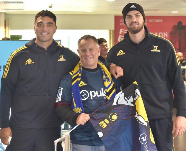 Dunedin local Phil Noye is flanked by Highlanders Teriaki Ben-Nicholas (left) and Manaaki Selby-...