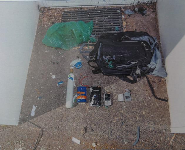 Police sifted through the insides of the hoax bomb after it had been neutralised. 