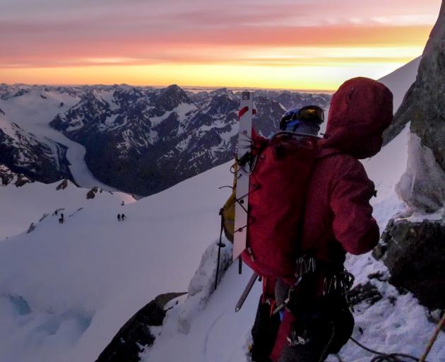 Paying respect to Aoraki Mt Cook at the base of the Summit Rocks. Photo: Supplied