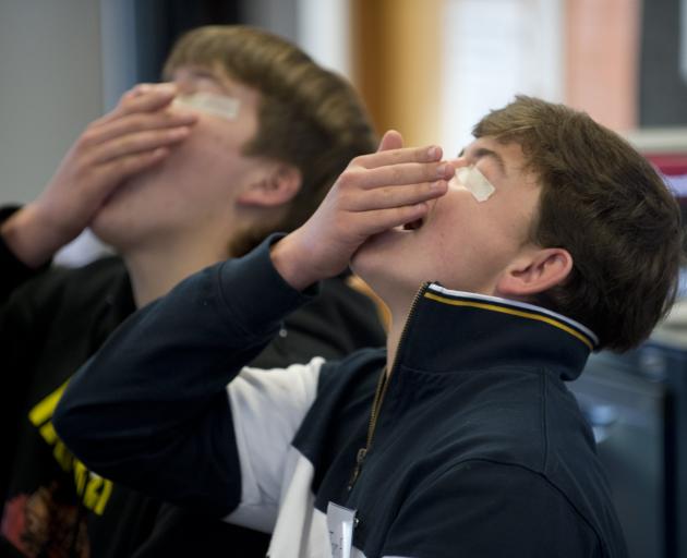 Trying their best in a blind insect eating challenge are Charles Engelbrecht (left) and Tom...