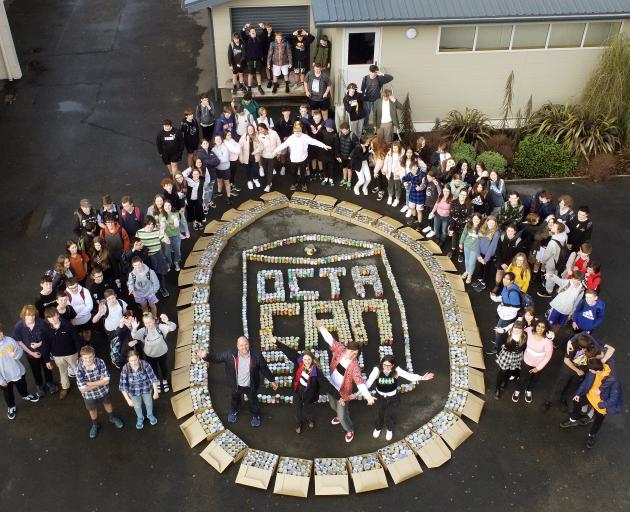 Taieri College pupils stand with 1800 cans collected for Octacan. PHOTO: STEPHEN JAQUIERY