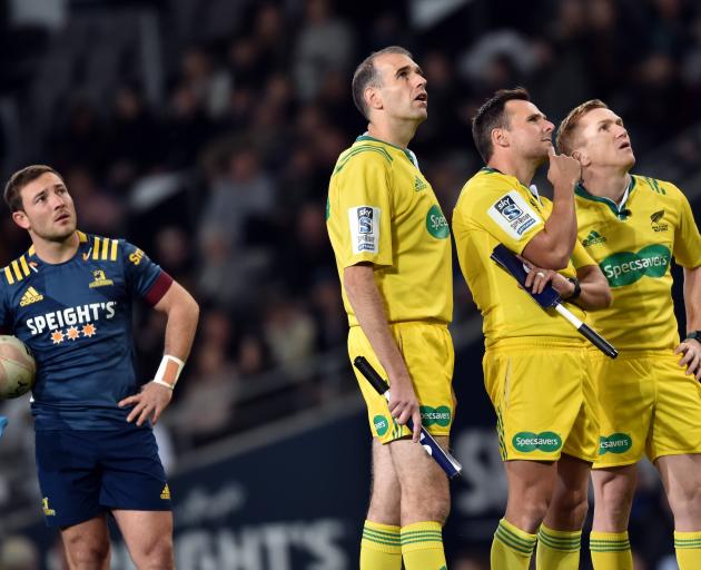 Watching the big screen at Forsyth Barr Stadium on Saturday night are Highlanders first five...