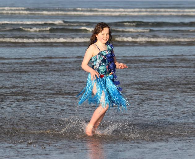 Returning from her swim at Taramea Bay is Lakisha Mennell (9).