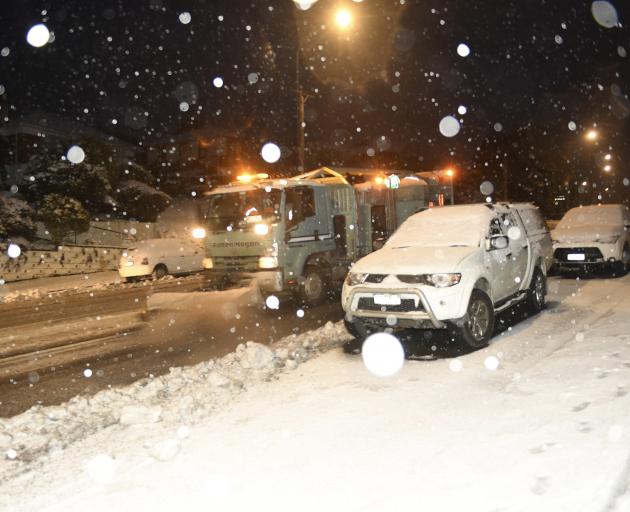 A Fulton Hogan truck ploughs snow in Taieri Rd this morning. Photo: Stephen Jaquiery A Fulton Hogan truck ploughs snow in Taieri Rd this morning. Photo: Stephen Jaquiery