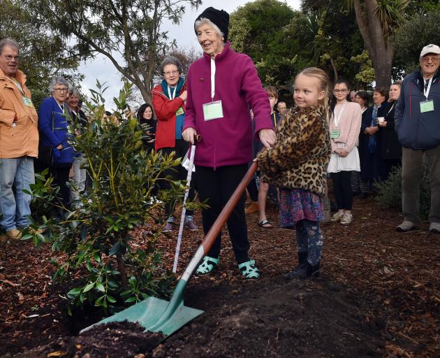 Mrs Spence plants a pohutukawa tree with current pupil Ivy Newton (5). PHOTOS: PETER MCINTOSH
