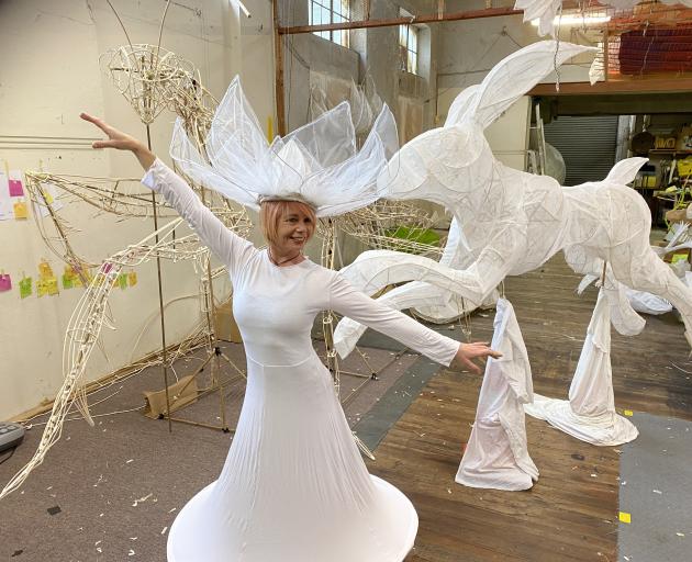 Dunedin Midwinter Carnival co-ordinator of performers Rochelle Brophy tries out one of the...