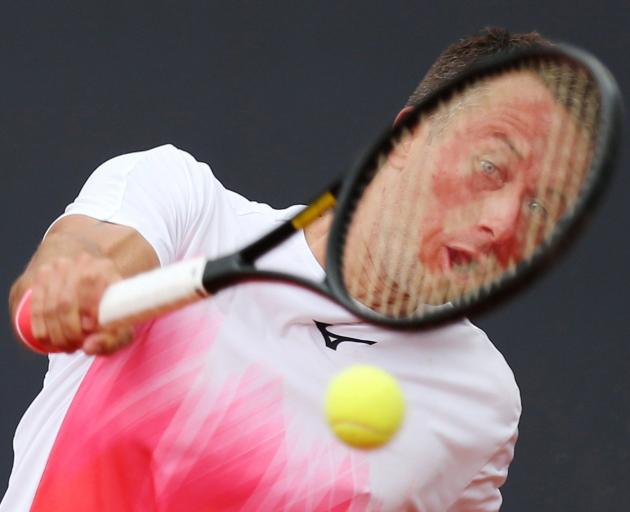 German tennis player Philipp Kohlschreiber plays a shot against Serbian Filip Krajinovic at the...