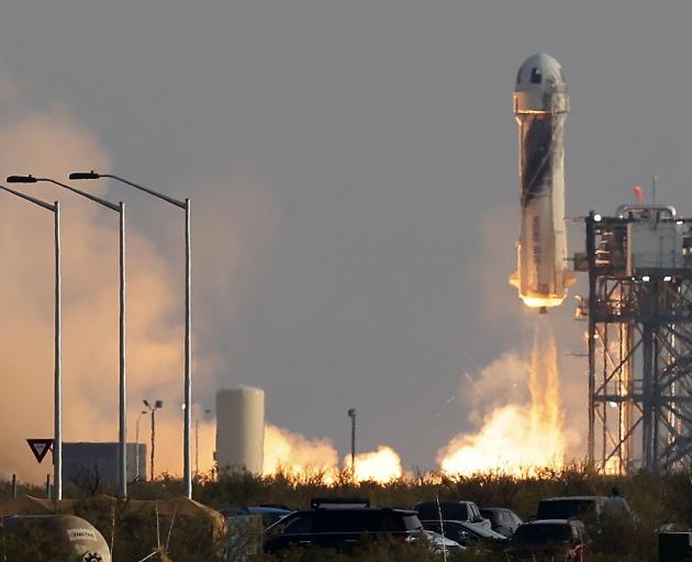 Billionaire businessman Jeff Bezos is launched, with three crew members, aboard Blue Origin’s New...