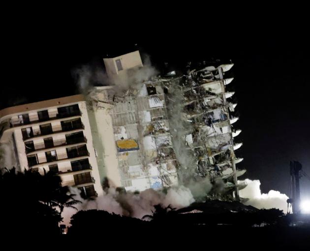The partially collapsed Champlain Towers South building was demolished on July 4 for safety...