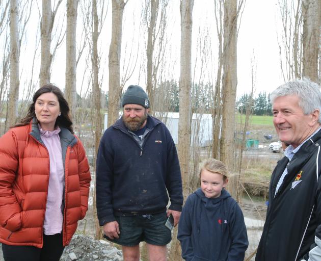 Rangitata MP Jo Luxton, Laurence Rooney, Honer Rooney (7) and Agricultural Minister Damien O’Connor at the Rooney Farm yesterday. PHOTO: LDR / ADAM BURNS