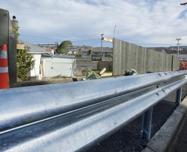 The Dunedin City Council has extended a traffic barrier at a notorious section of Musselburgh...
