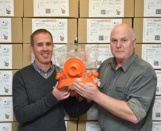 Mark Seaton (left) and Richard Aimers, of SouthMED Ltd, display one of their ventilator hoods,...