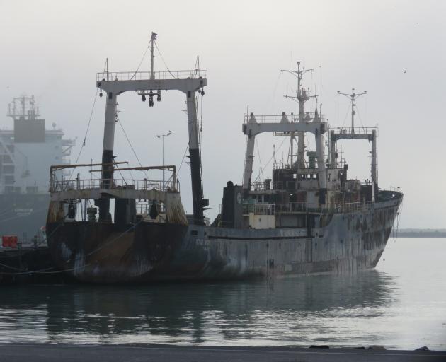 The burnt-out Dong Won 701 sits at Timaru’s Primeport before it was towed to its scuttling site...