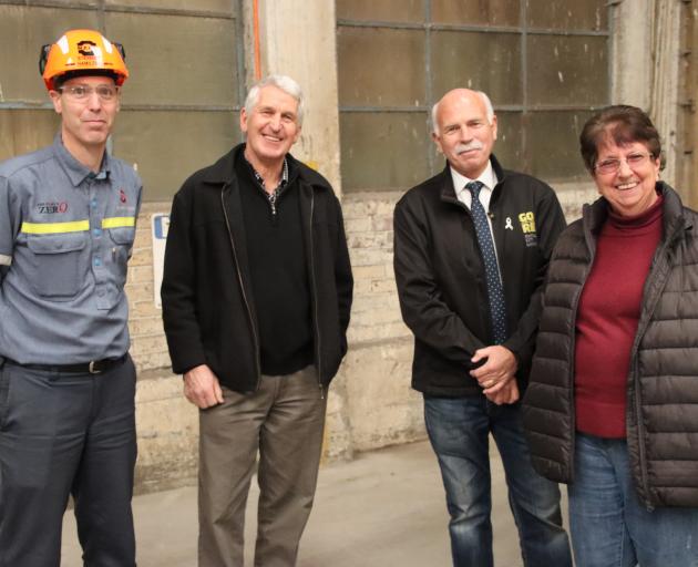 Pausing to chat during a stroll through the now empty former Mataura Paper Mill are (from left)...