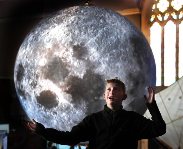 Amazed by a giant moon replica is Fin Auchinvole (11), of Dunedin, at Hanover Hall yesterday....