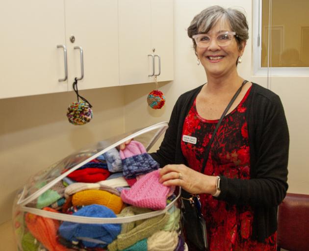 Christchurch Women's Hospital charge midwife manager Amanda Daniell with the donated woollen...