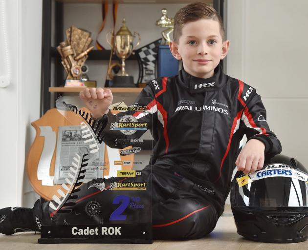 Kart racer Jack McGrath (9), of Mosgiel, with the second-place trophy he won at the national...