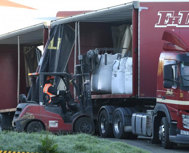 A forklift loads ouvea premix from Mataura’s disused paper mill on to a truck. PHOTO: STEPHEN...