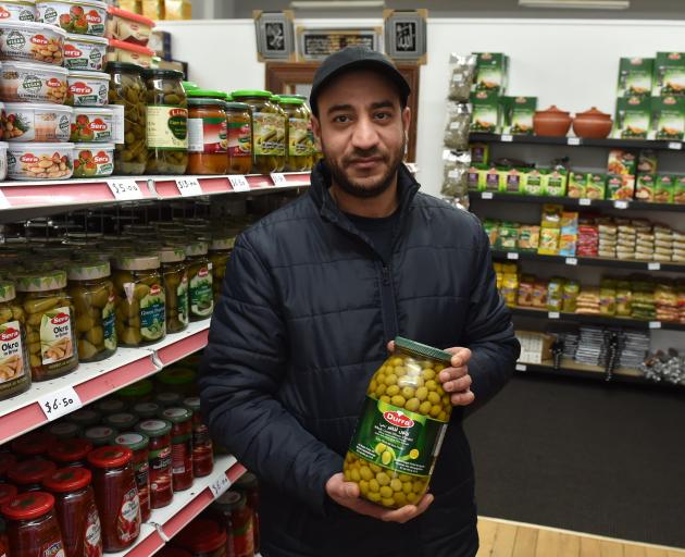 Mohamed Alomar stands in his new Arabic supermarket that will open on Monday. PHOTO: GREGOR...