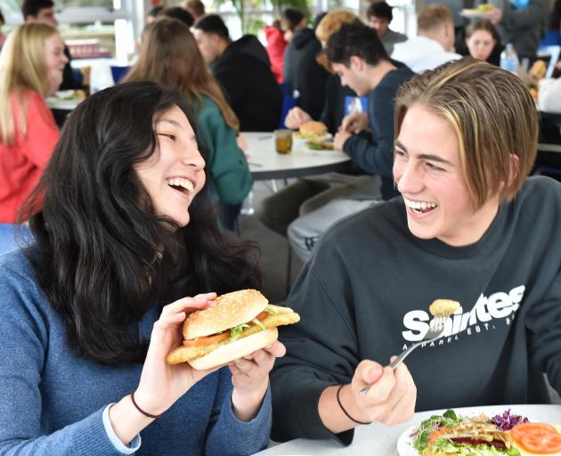  Enjoying a meat-free schnitzel at Aquinas College yesterday are sub-warden Sara Aruquipa and...