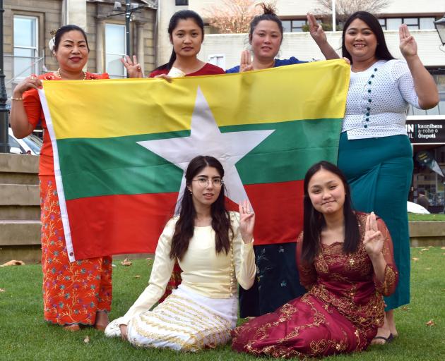 Holding the flag of Myanmar to spread awareness of a fundraising concert in Dunedin later this...