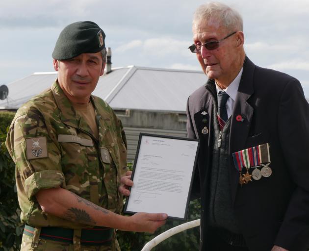 Lieutenant-colonel Tim Tuatini delivers a letter from the Chief of Army to congratulate (Peter)...