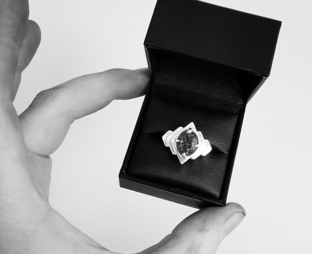 Echo Cocktail Ring; the tourmalinated quartz stone is held in radiating waves of geometrically...