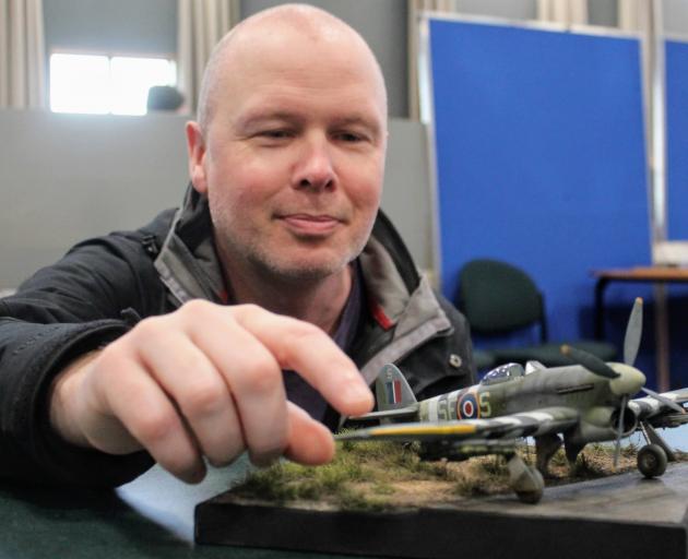 John Fenton proudly displays his model Hawker Typhoon, which won best of the show at South Island...