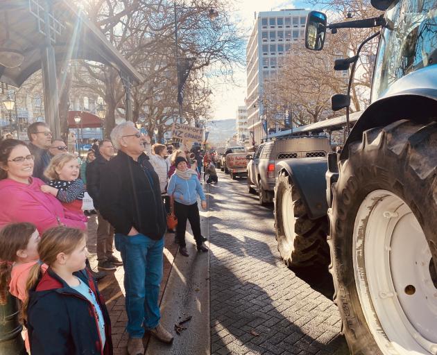 A convoy of farm vehicles heads through the Octagon. Photo: Craig Baxter