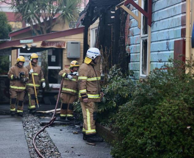 Firefighters at the scene of a house fire in Westport. Photo: NZ Herald