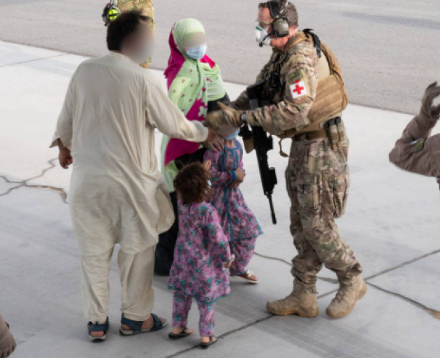 Evacuees from Kabul arrive onboard an RNZAF C130 Hercules into Al Minhad Air Base in UAE. Photo:...