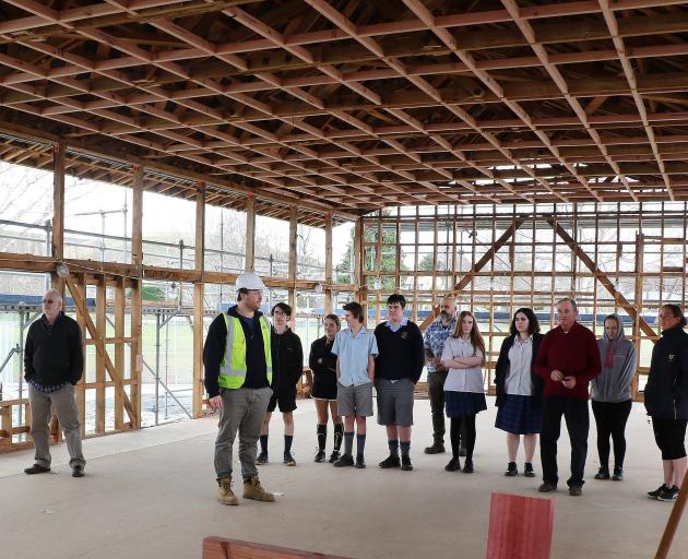 Lawrence Area School rebuild contractors Naylor Love show senior pupils and staff the progress made on new classrooms and facilities during a recent tour. PHOTO: JOHN COSGROVE