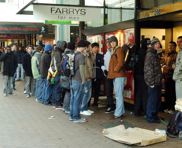 Bargain hunters form a 50m queue shortly before doors opened on a sale at Farrys’ store in...