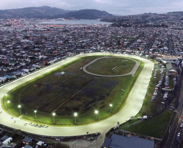  Horses thunder around the Forbury Park home bend as action gets under way on the last night of...