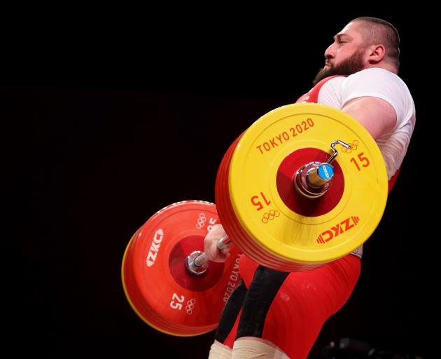 Georgian weightlifter Lasha Talakhadze barrels his way to Olympic gold. PHOTO: GETTY IMAGES