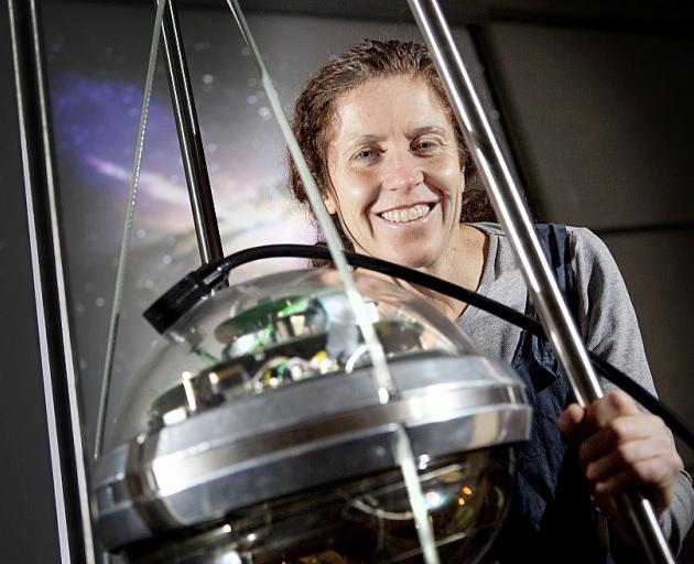 Award-winning theoretical physicist Jenni Adams with a sensor once used in the multi-national...