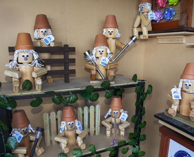 Rockhouse sells his Millgate Woodworks Garden Pot People at local markets. Photo: Geoff Sloan
